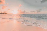 a pink sunset on a beach in the caribbean